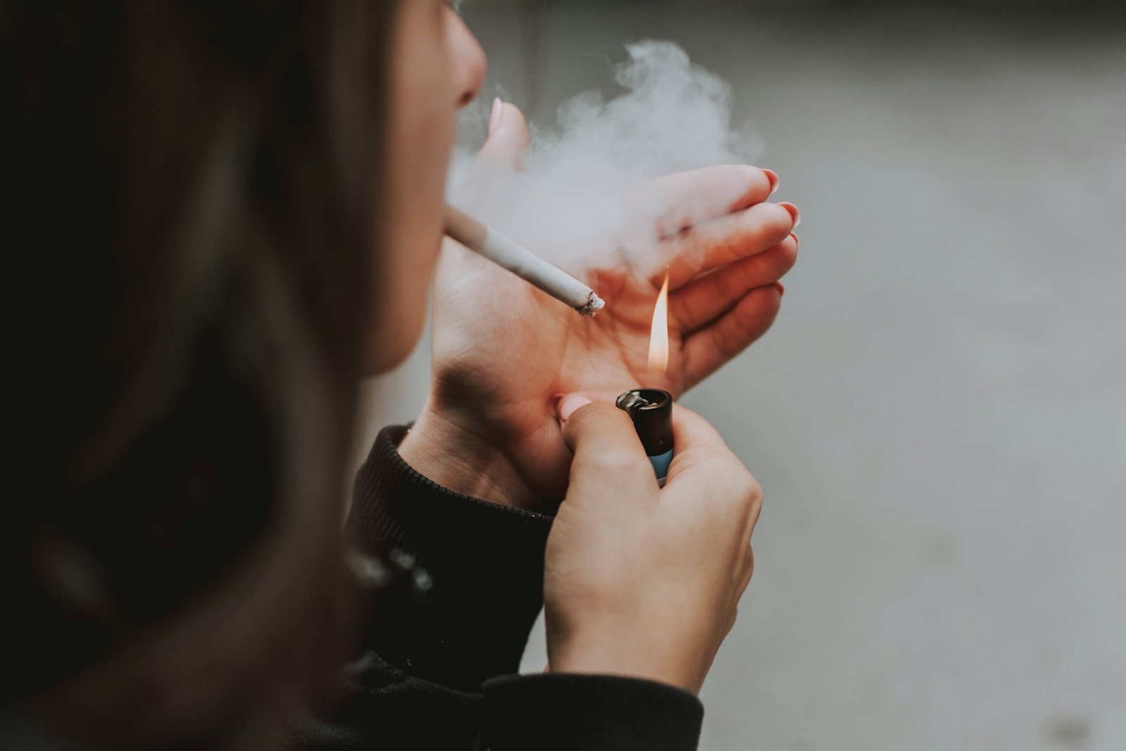 creative-marketing-26 woman lights her cigarette with lighter